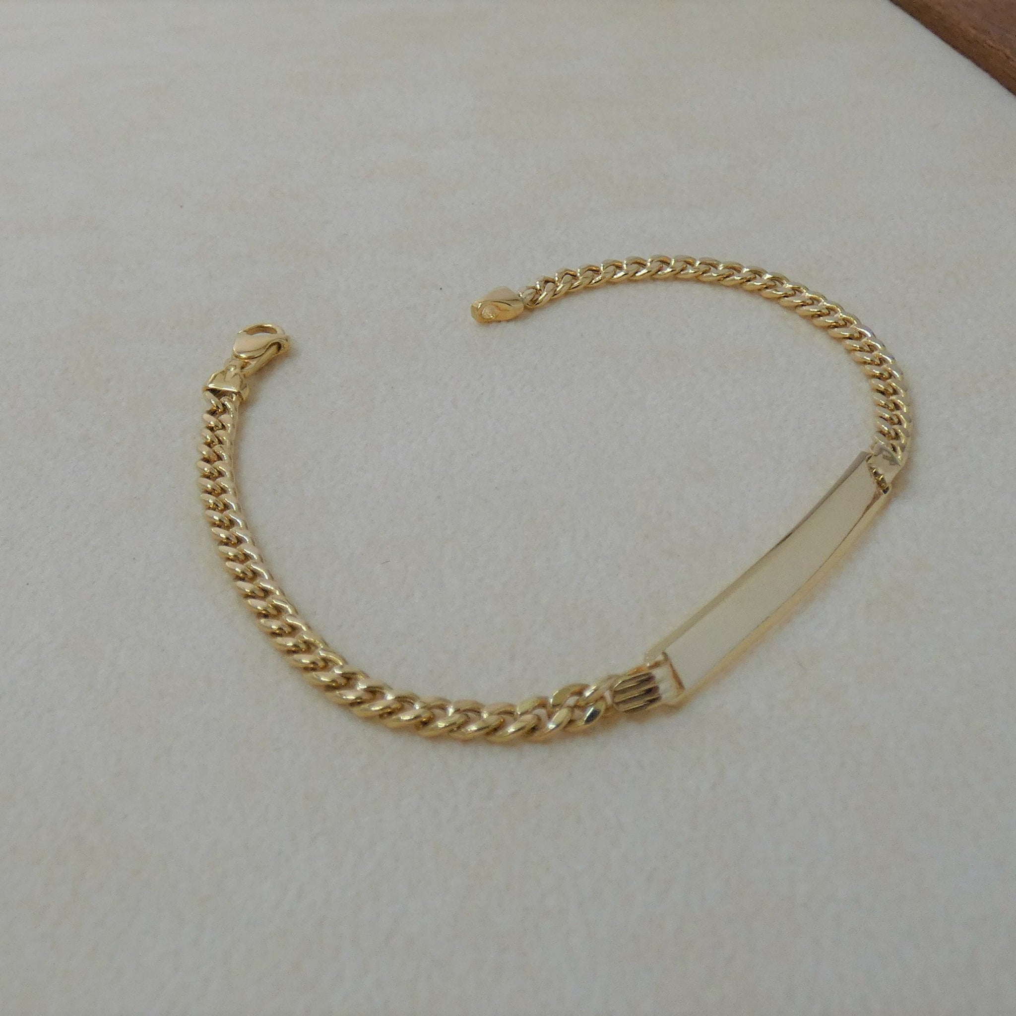 BRACCIALE UOMO IN ORO GIALLO CON PIASTRINA